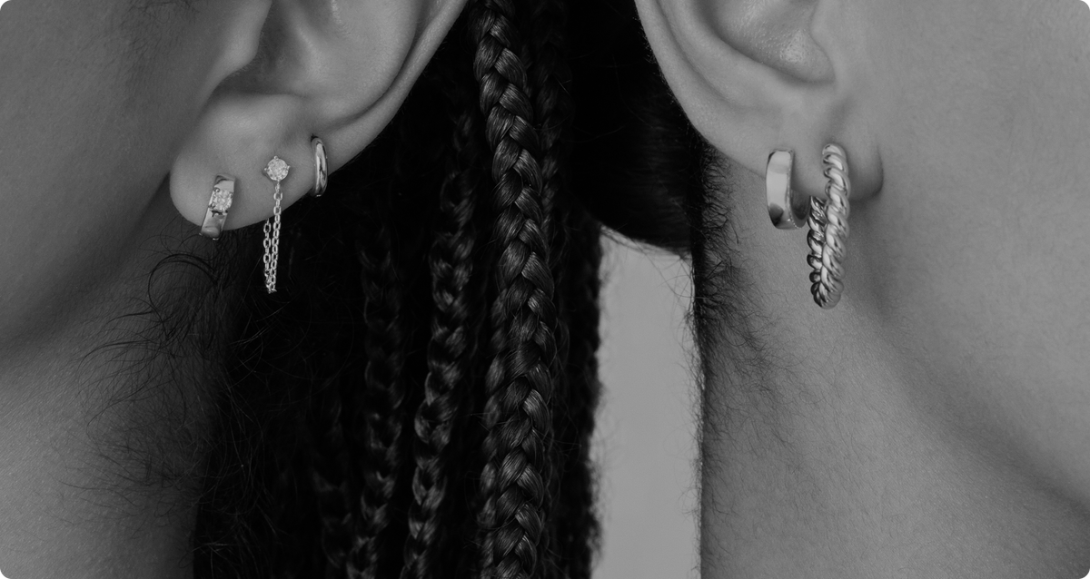 Close-up of stacked gold earrings